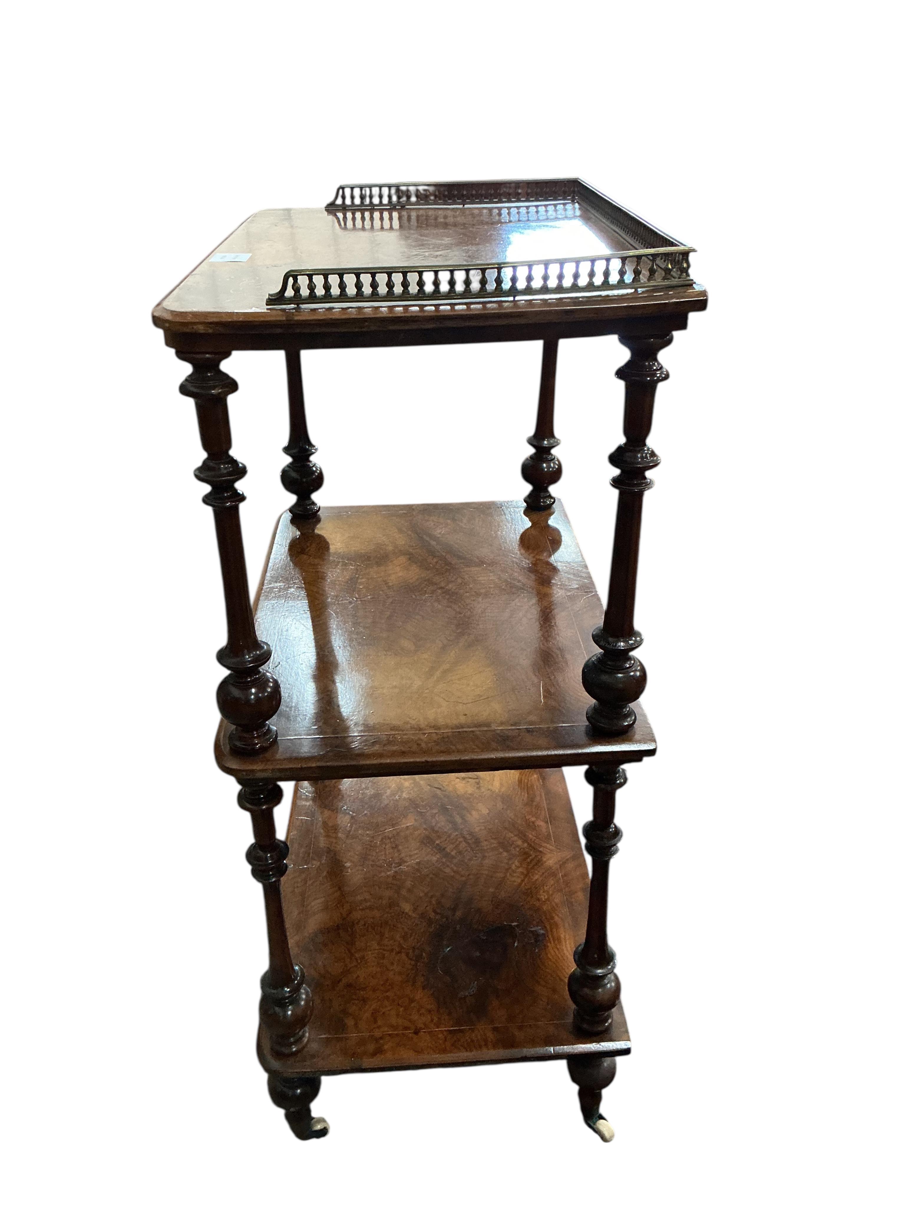 A Victorian walnut three tier whatnot, width 60cm, depth 40cm, height 95cm
